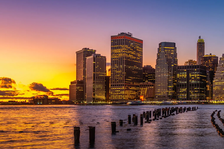 city skyline on coast at sunset