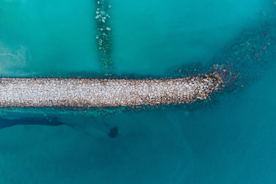 stone path crumbles into sea