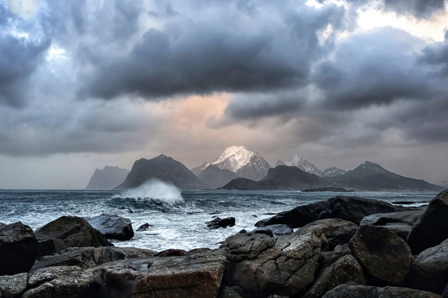 rough waves mountain in distance