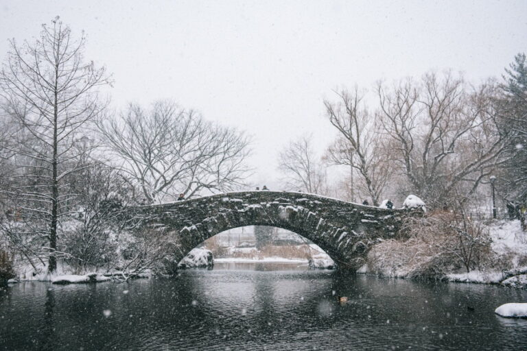 snowy bridge across river