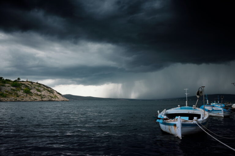 boats with storm in background
