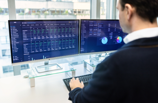 Man working at computer screens