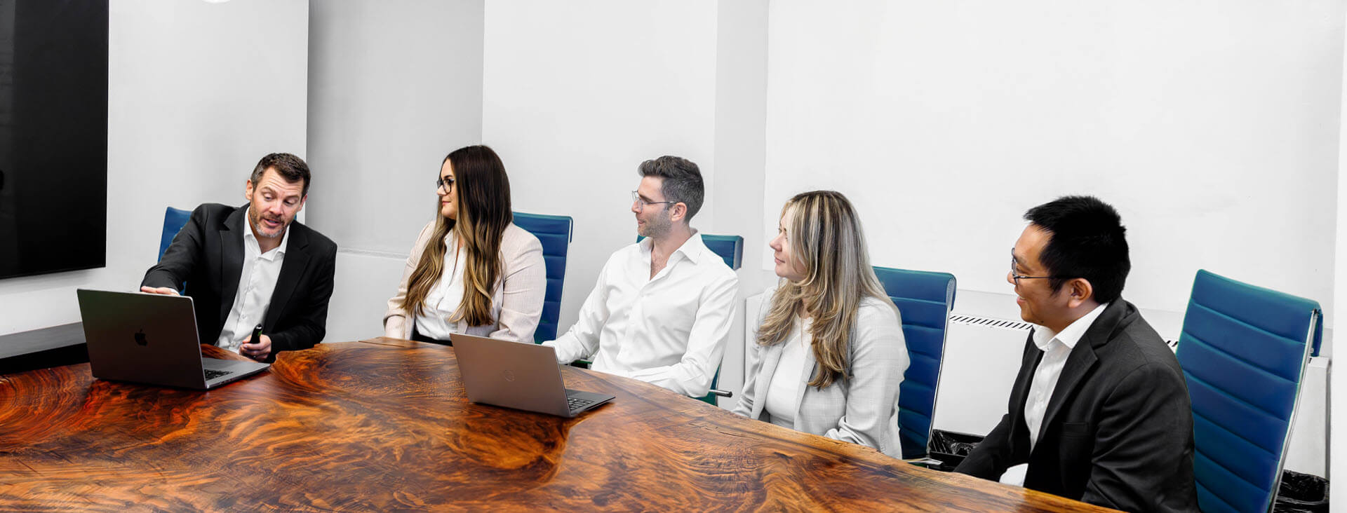 group of professional sitting around a conference table