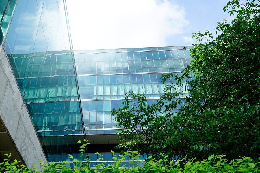 Modern building with greenery in front